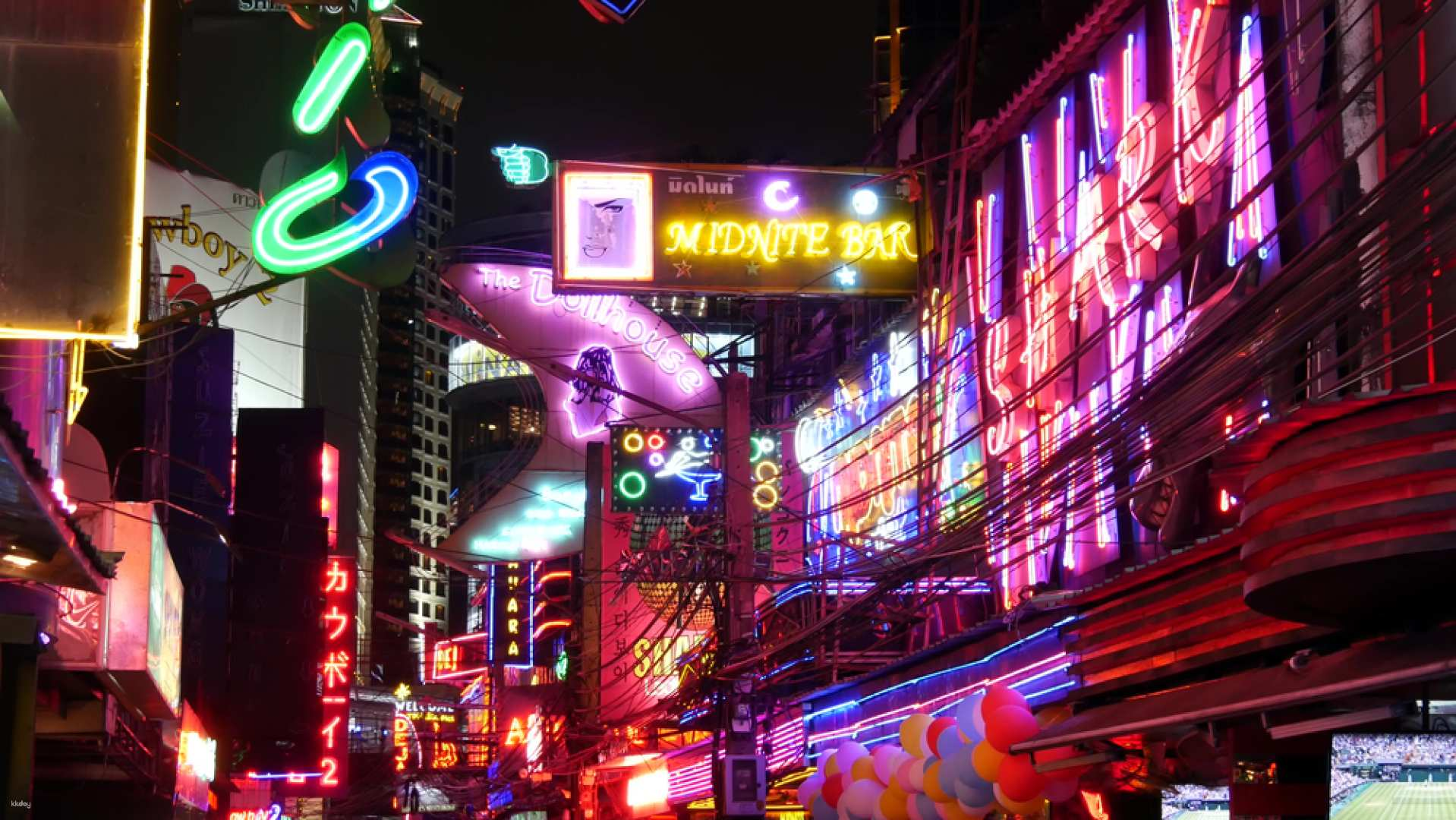 Discover the charm of Bangkok's nightlife exploring lively streets adorned with neon lights while savoring drinks and mingling with locals in this unforgettable bar hopping experience.