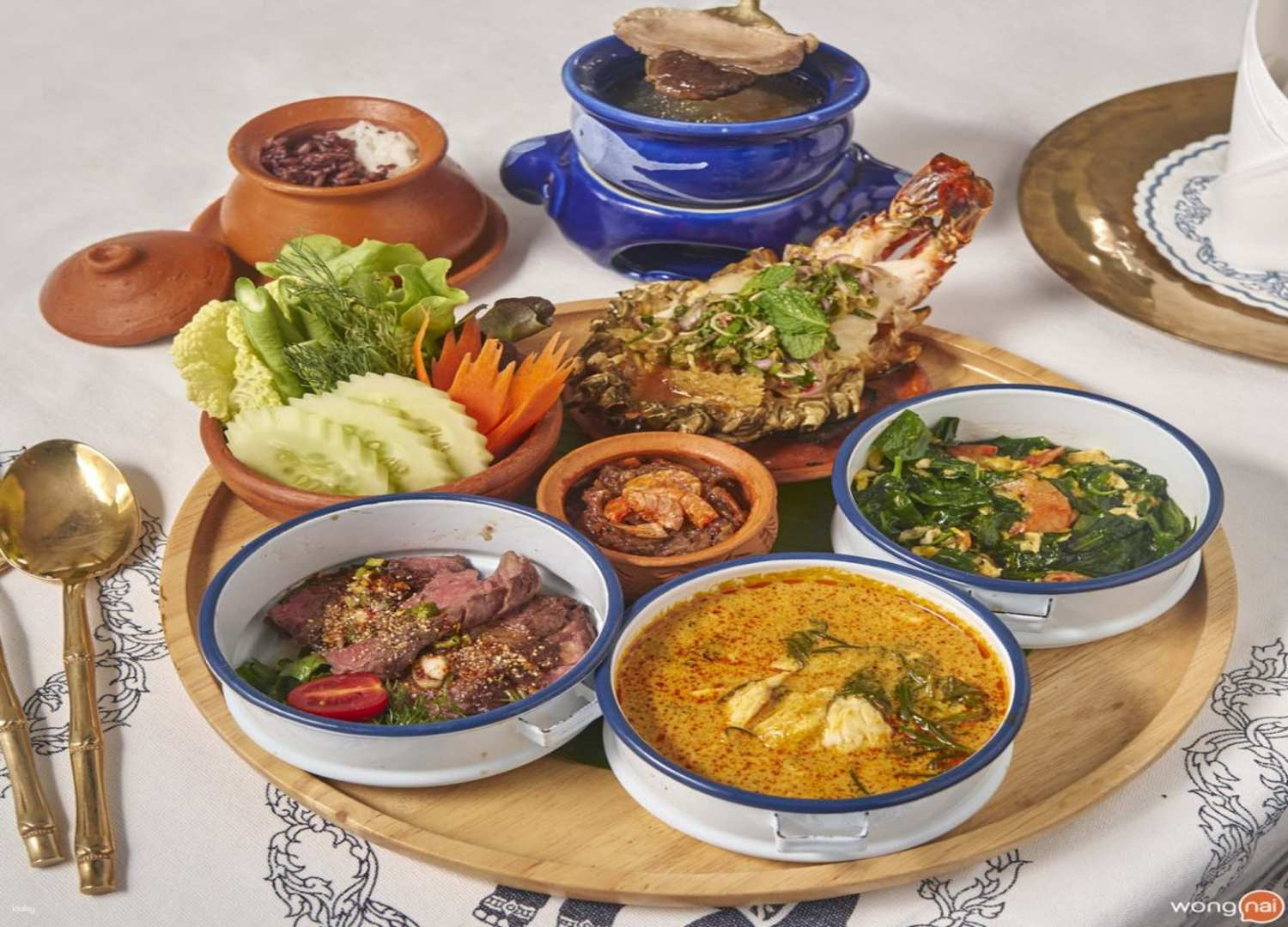 Experience a culinary journey at Blue Elephant Restaurant where traditional Thai recipes are beautifully presented in a charming setting steeped in history inviting travelers to savor authentic flavors.