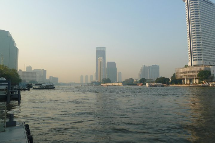 Experience the charm of Bangkok's canals as you glide along the Chao Phraya River observing local life and iconic landmarks like the Grand Palace and Wat Arun on your journey.