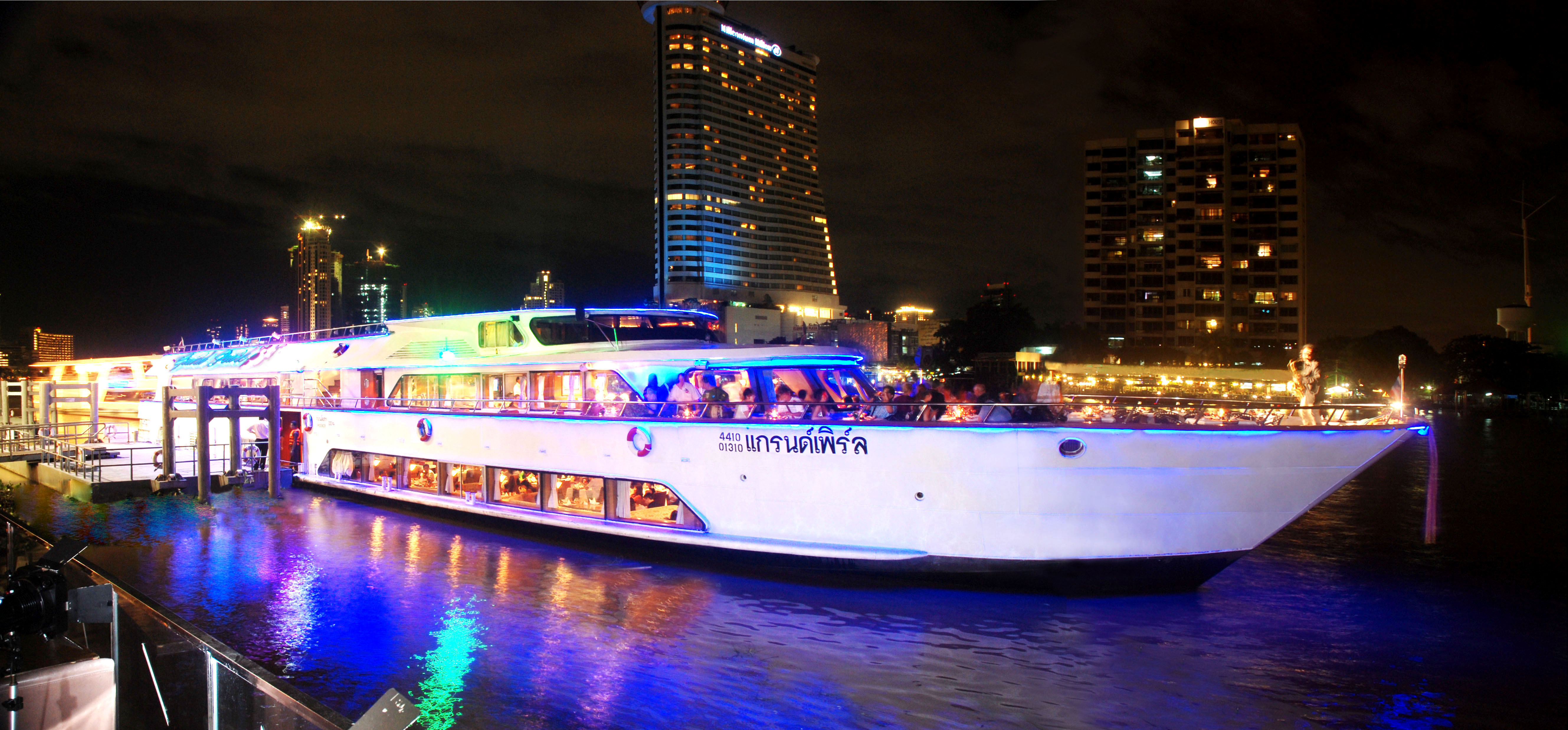 Experience Bangkok's charm with a gleaming dinner cruise along the Chao Phraya River savoring exquisite Thai cuisine and enjoying views of the beautifully lit cityscape and historic landmarks.