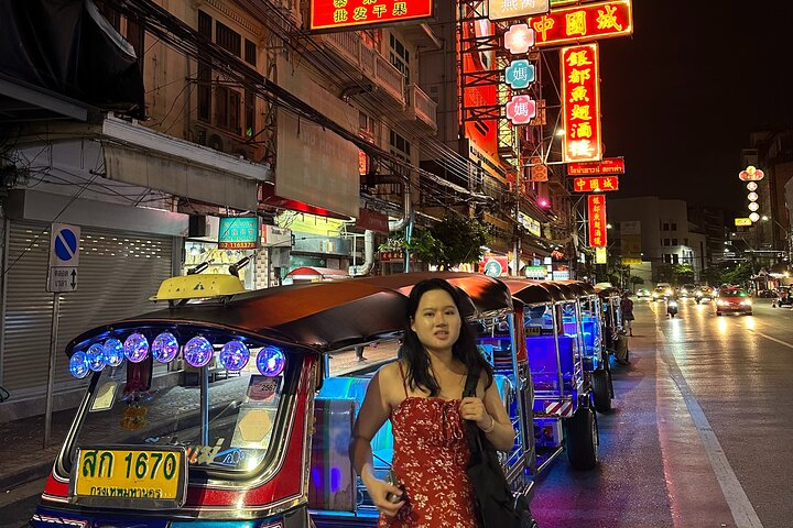 Experience Bangkok's evening charm as you venture through illuminated streets enjoy local delicacies and explore the city's rich culinary culture alongside friendly locals on your food tour adventure.