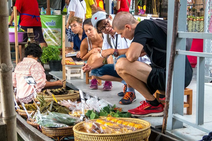 Experience the charm of Bangkok as you explore the lively floating markets interacting with local vendors and discovering unique goods along the picturesque canals. Truly a memorable adventure!