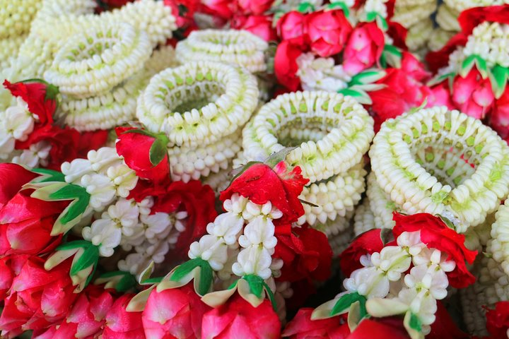 Delve into the rich colors and intricate designs of handmade Thai floral garlands where each creation reflects local artistry and deep-rooted cultural traditions perfect for a unique travel experience.