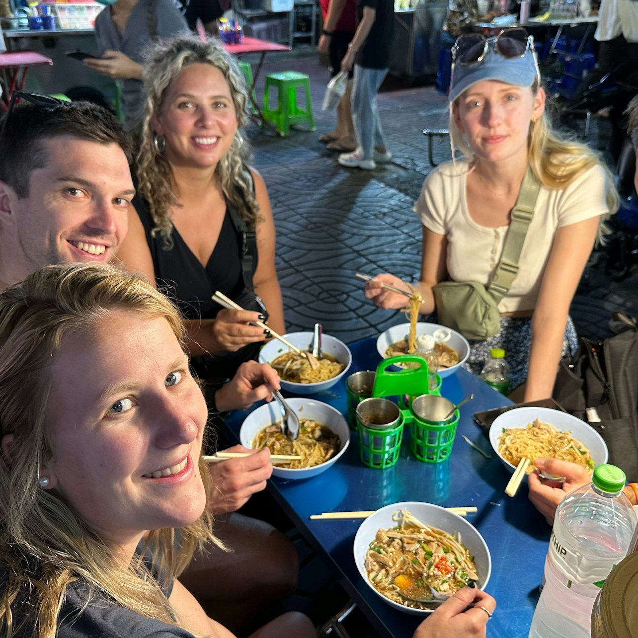 Indulge in the flavors of Chinatown with friends savoring delicious street food delicacies and connecting with local vendors amidst a lively backdrop of culinary delights.