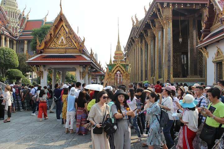 Experience the beauty of the Grand Palace and its stunning temples as you join fellow travelers in exploring rich cultural heritage and unique local handicrafts in Bangkok.