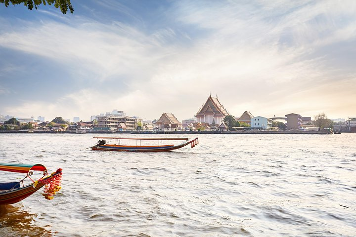 Explore the serene waterways and charming shophouses of Thonburi where each turn reveals hidden temples and local life perfect for a unique Bangkok experience away from the crowds.