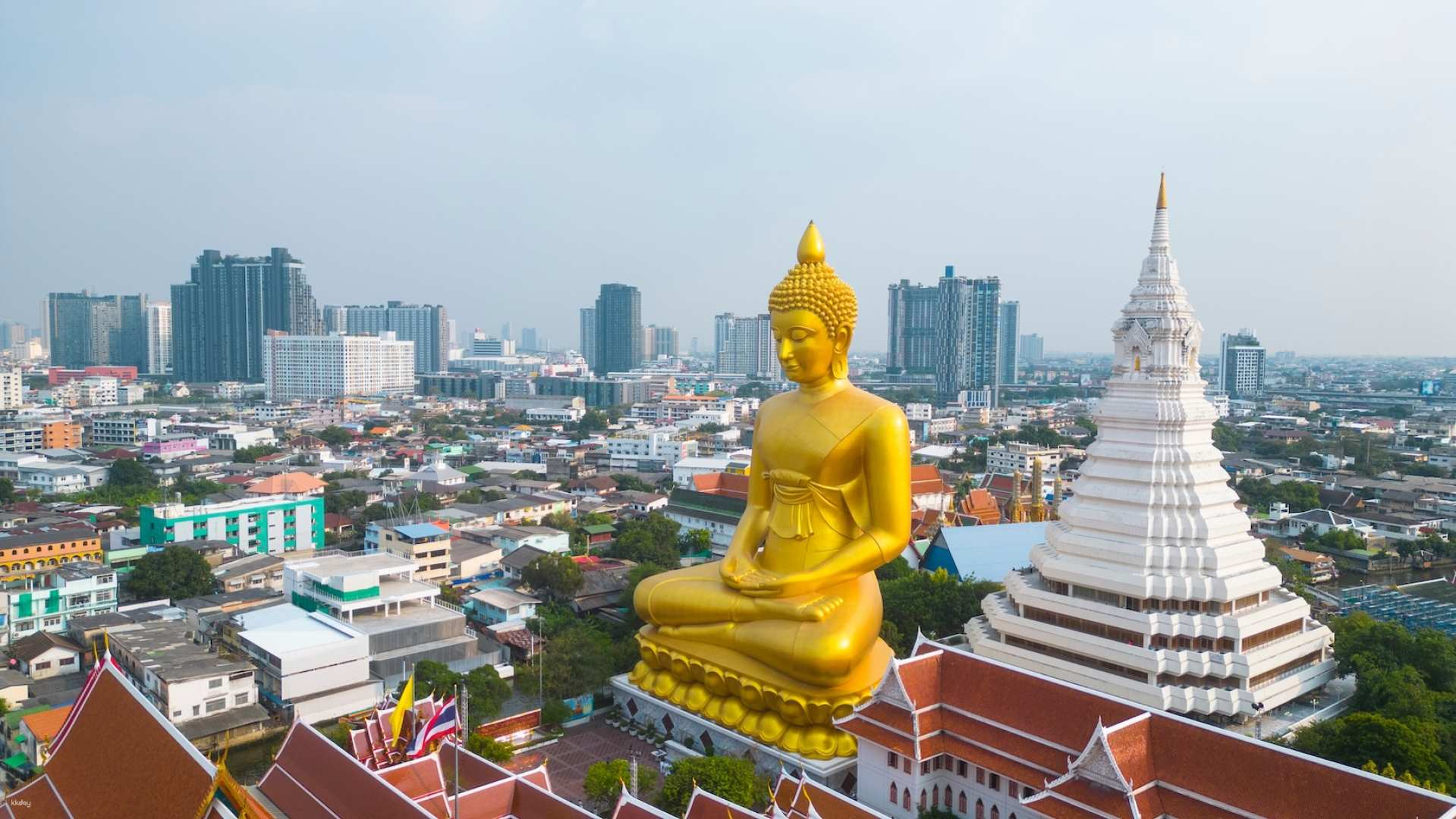 Experience the intricate beauty of Bangkok's temples where stunning architecture and rich history invite exploration complemented by the lively atmosphere of local markets and serene perspectives.