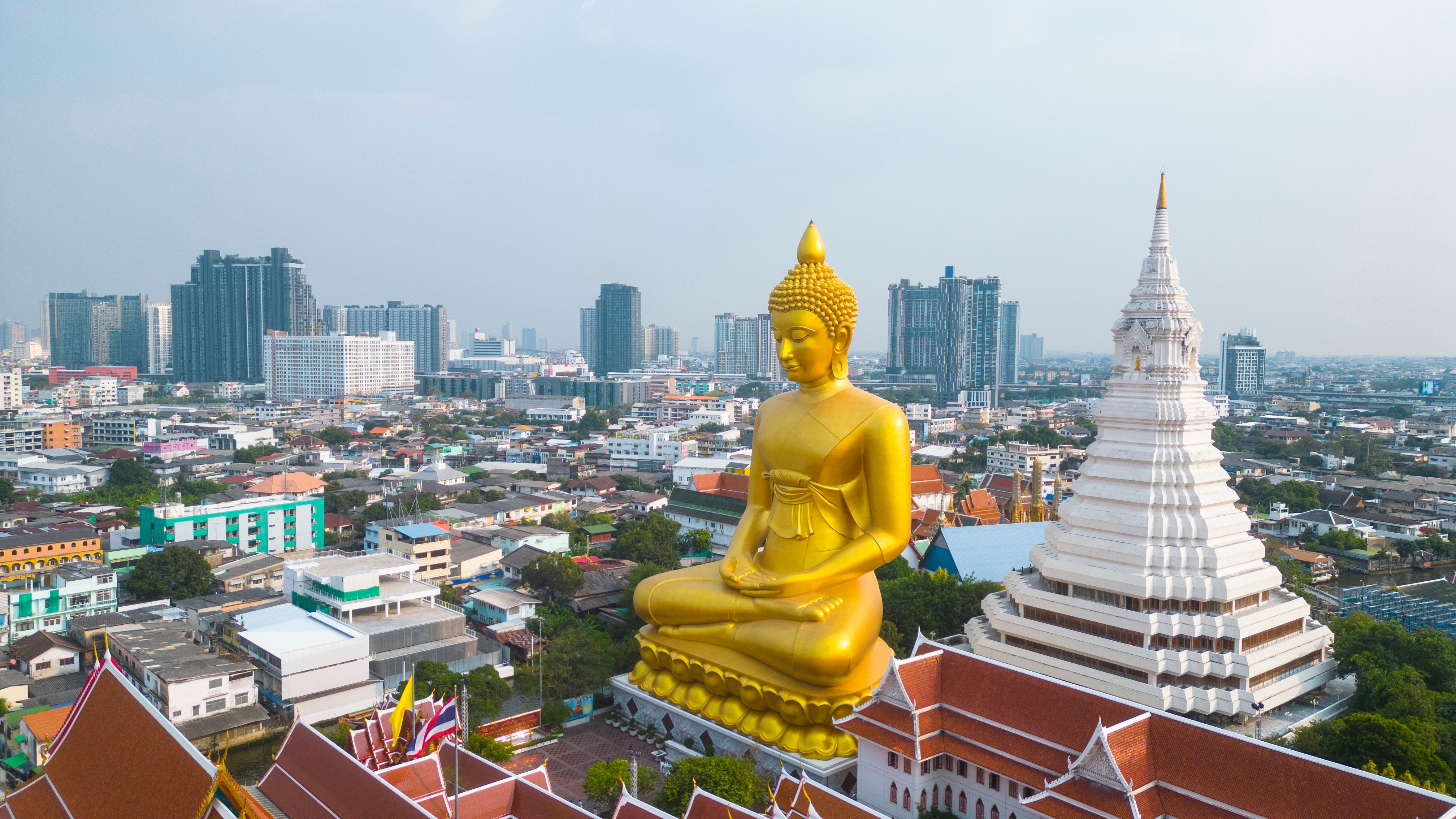 Explore Bangkok's iconic temples where stunning architecture meets spiritual devotion. Marvel at the towering golden Buddha and the intricate designs making each moment unforgettable for every traveler.