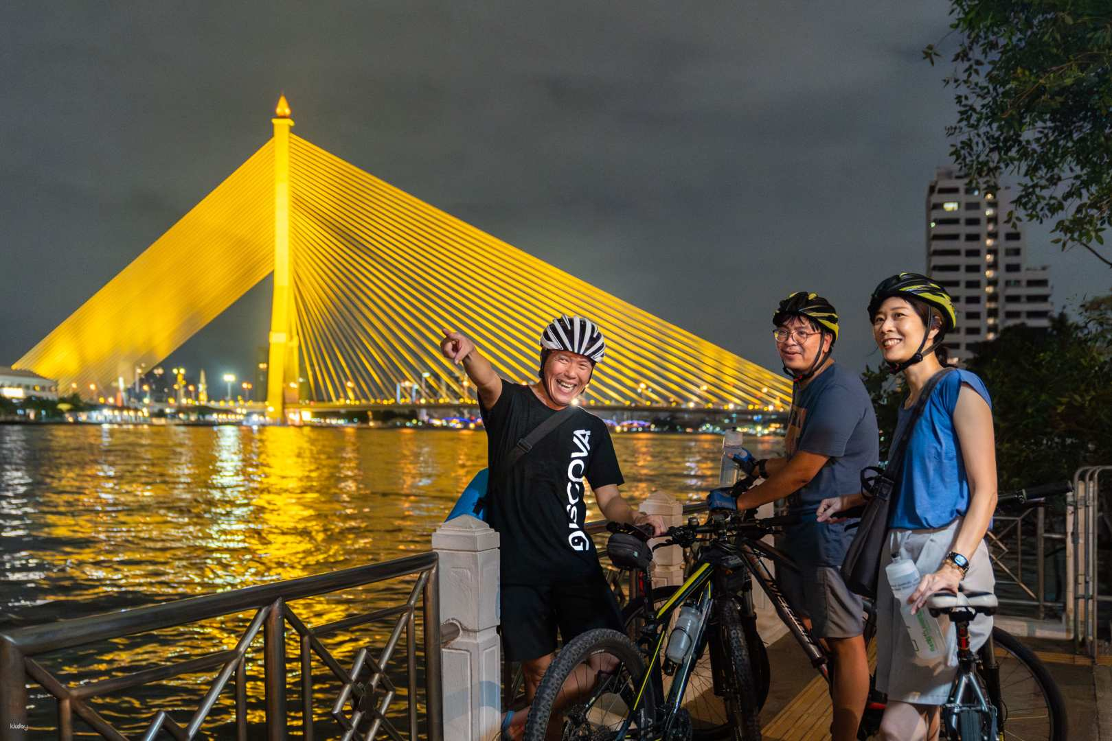 Experience the charm of Bangkok at night cycling past illuminated landmarks and riverside views while exploring hidden markets and ancient temples with fellow adventurers.