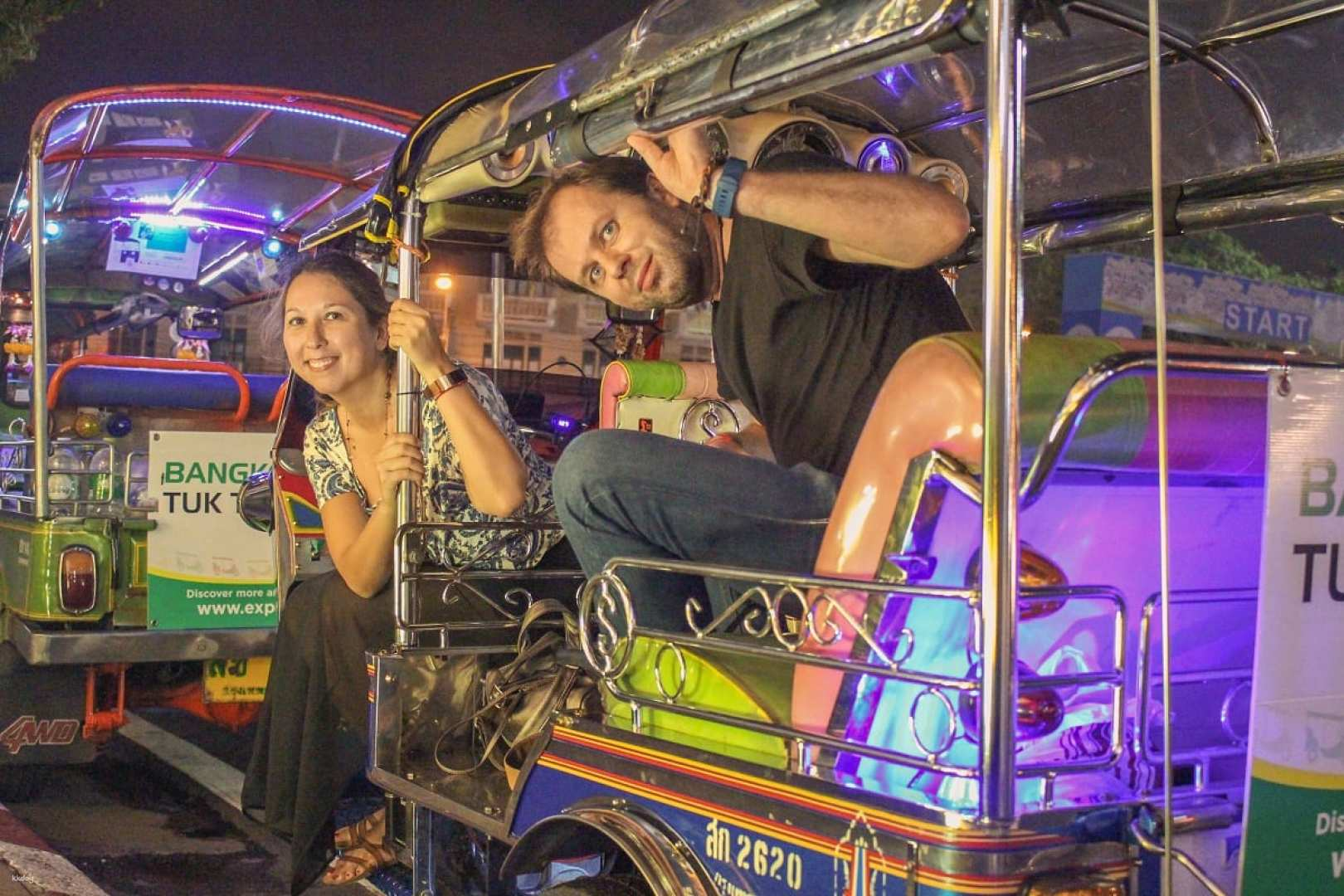 Experience the magic of Bangkok's nighttime journey aboard a tuk-tuk discovering bustling markets illuminated temples and mouthwatering street food creating unforgettable memories along the way.