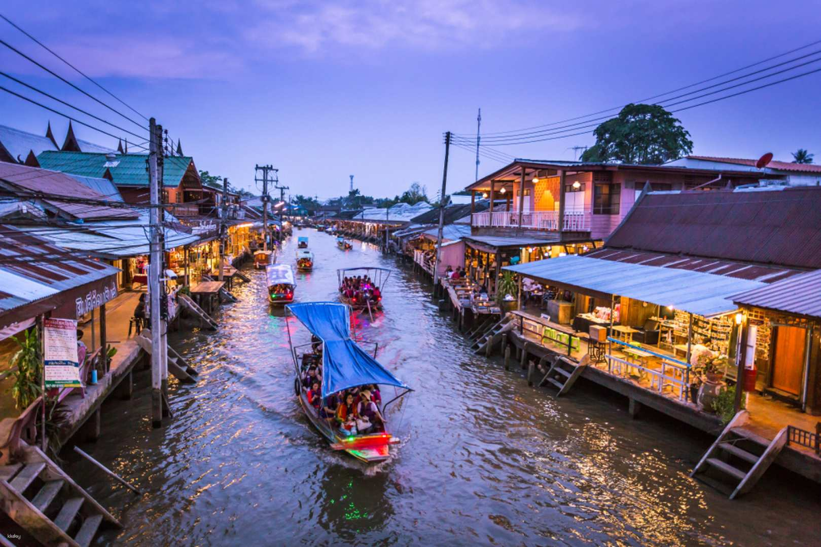 Experience the charm of Thailand’s floating markets with boats gliding through serene canals surrounded by local shops and delicious street food perfect for leisurely exploration and discovery.