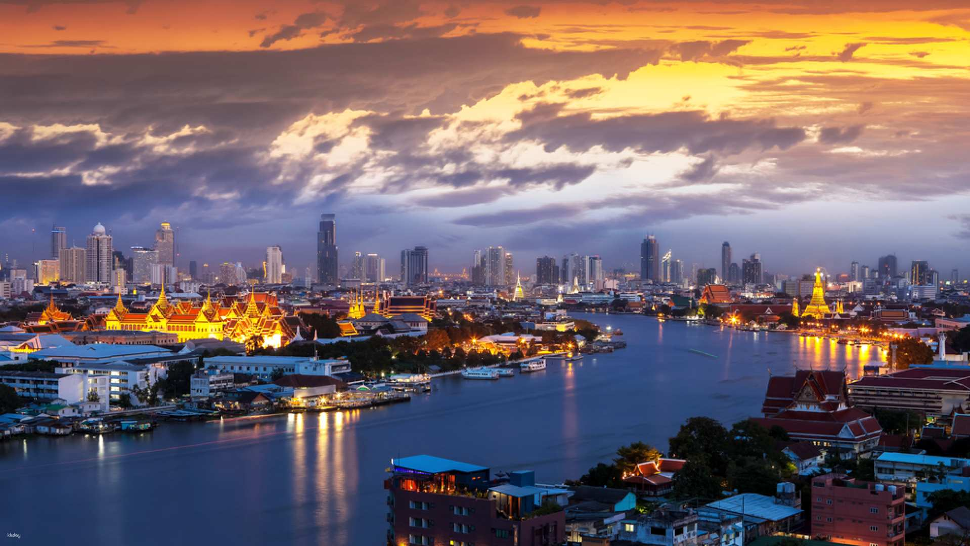 Experience the charm of Bangkok as the sun sets illuminating lush temples and modern skyscrapers along the Chao Phraya River creating a picture-perfect backdrop for unforgettable memories.