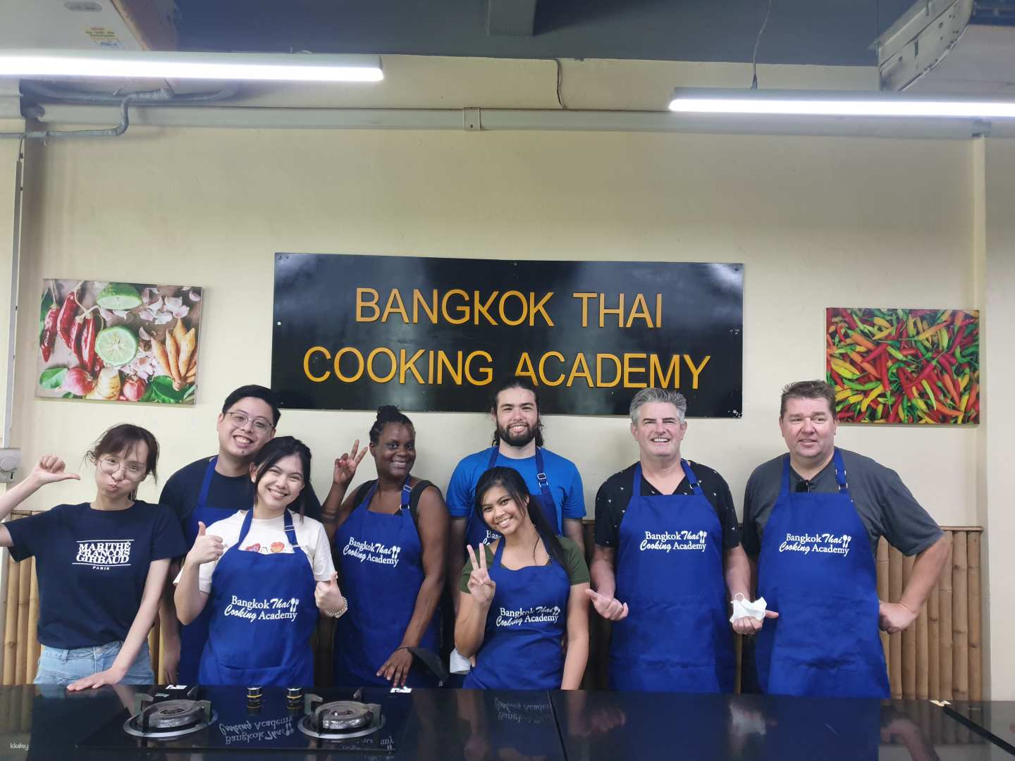 Learn the art of Thai cooking alongside enthusiastic chefs surrounded by colorful decor and a lively atmosphere all while crafting delicious dishes tailored to your taste.