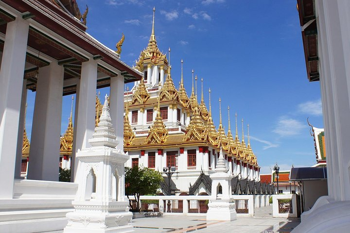 Experience the majestic architecture and intricate details of Bangkok's temples merging beauty with a compelling narrative of resilience and the quest for democracy. Uncover stories waiting to be told.