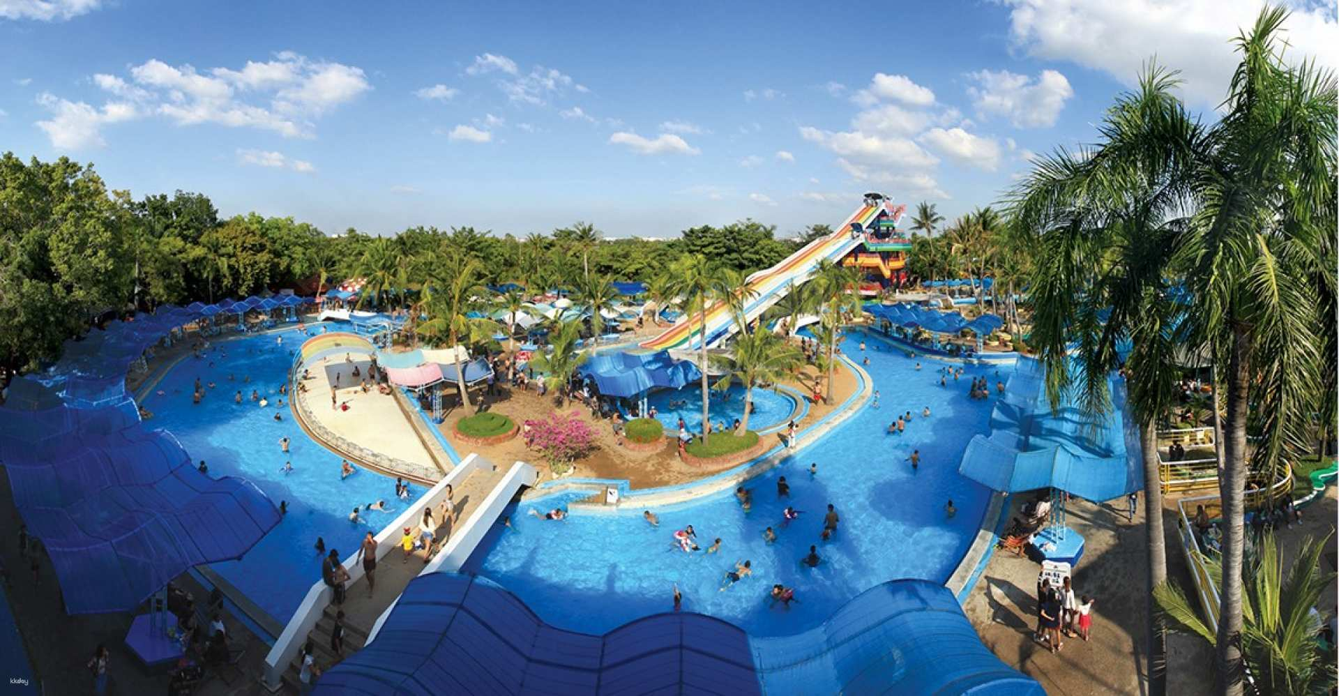 Immerse yourself in a day of fun enjoying water slides and attractions amid lush greenery at Bangkok’s top amusement parks perfect for families and adventure seekers alike.