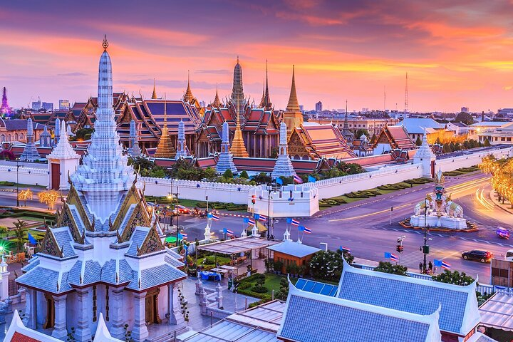 Explore Bangkok's stunning temples at sunset where intricate architecture meets the glowing skyline offering a glimpse into the city's rich heritage and enchanting waterways. Experience a journey like no other.