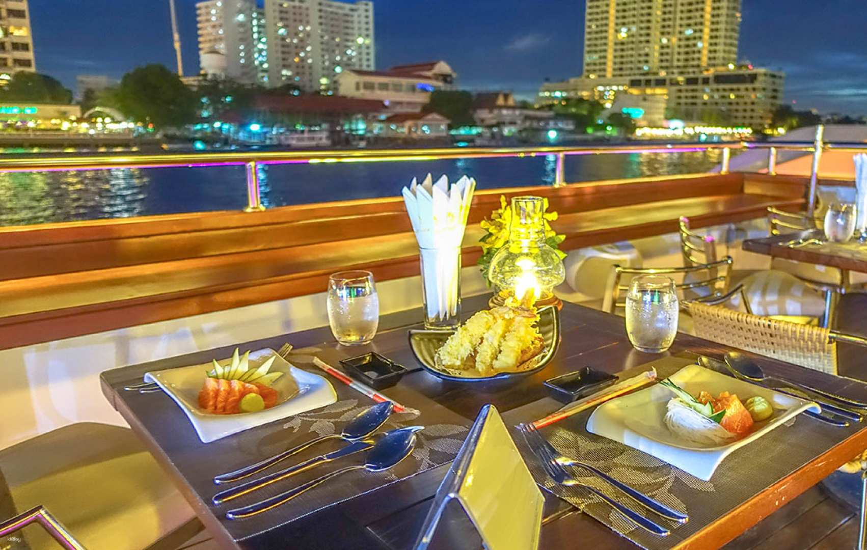 Savor a delightful buffet while enjoying stunning views of Bangkok's skyline and landmarks along the Chao Phraya River creating cherished moments on a luxury dinner cruise.