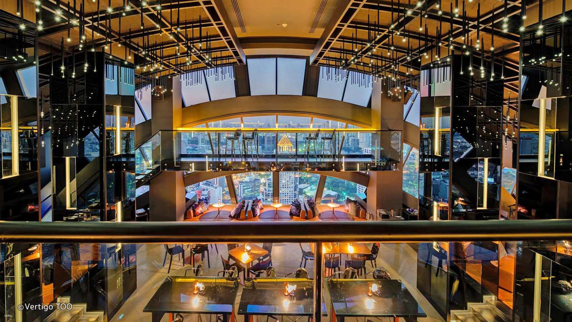 Experience the stunning skyline views and stylish ambiance of Banyan Tree Vertigo TOO Sky Bar where the city lights shimmer while you enjoy endless drinks in Bangkok.