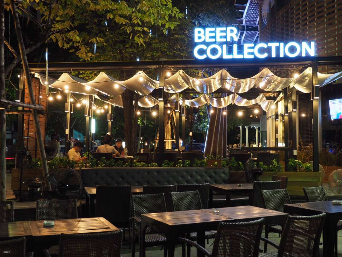 Sip on the finest international beers under soft lights savoring global flavors in a cozy beer bar that's perfect for unwinding after a day of exploration in Bangkok.