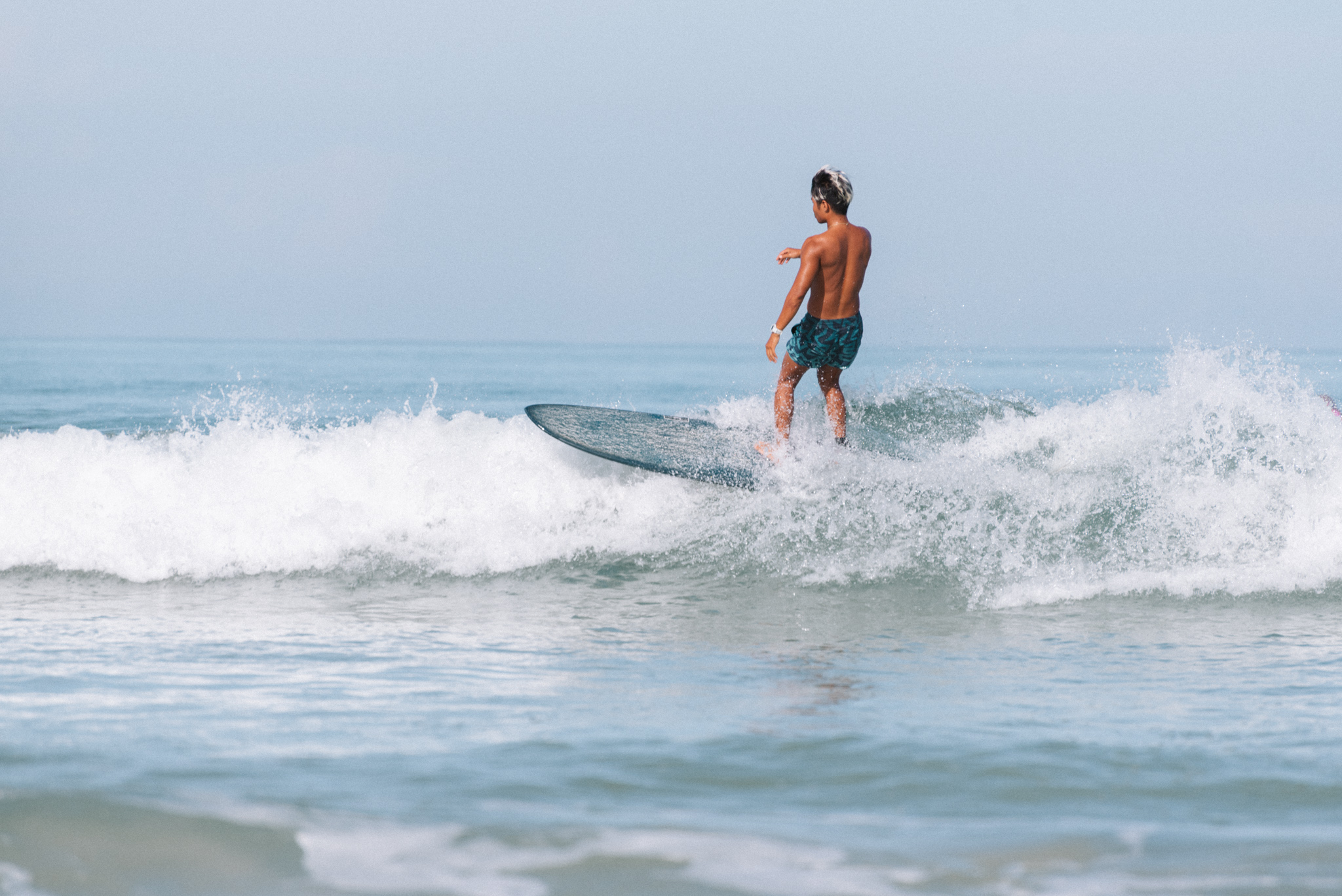 Experience the joy of riding gentle waves at Memories Beach perfect for both beginner and advanced surfers set against the stunning backdrop of Phuket's beautiful coastline.