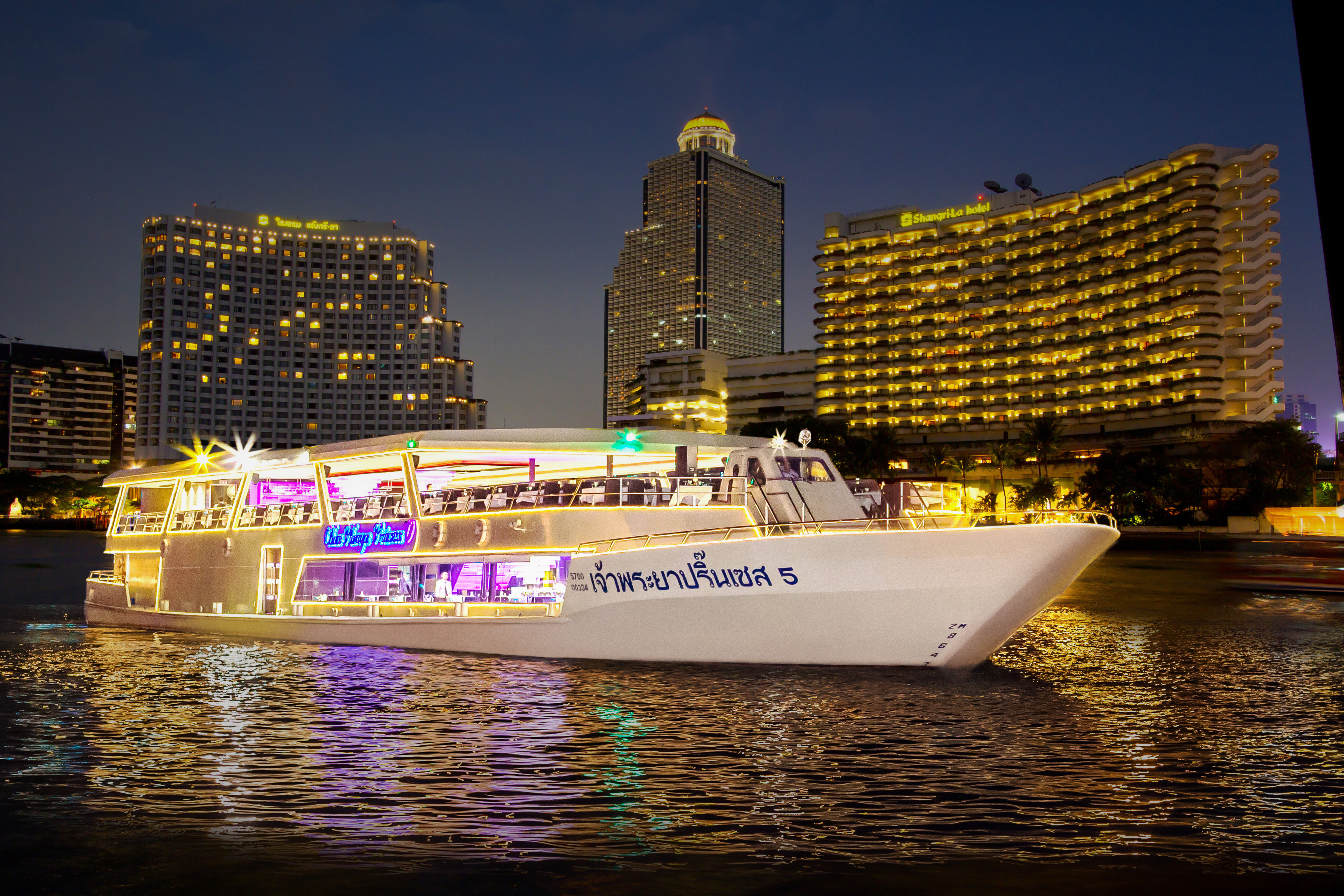 Experience a delightful evening on the Chao Phraya River savoring exquisite cuisines while enjoying live music against the stunning backdrop of Bangkok's illuminated skyline.