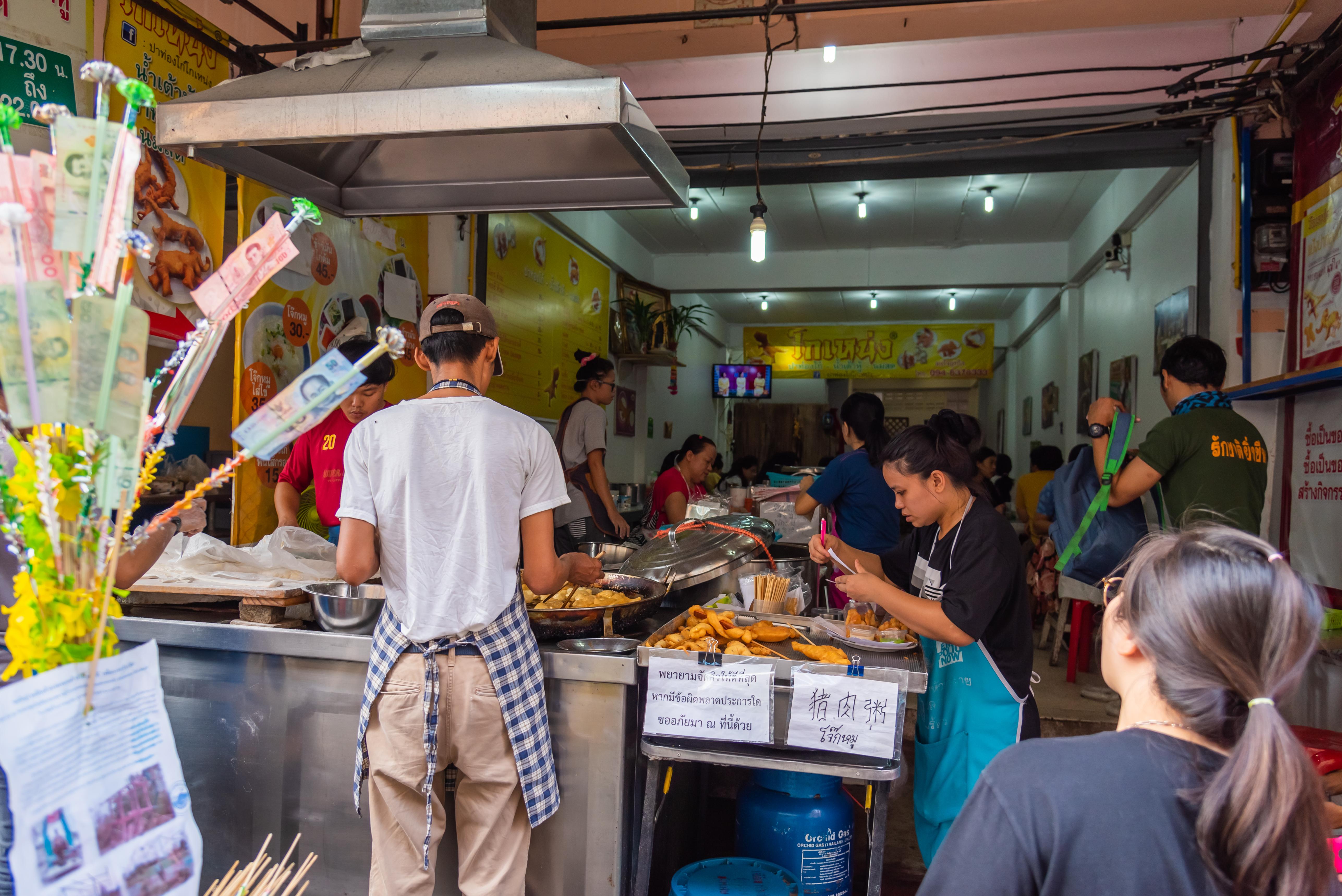 Delve into the bustling food scene of Chiang Mai savoring delicious Michelin-rated dishes while interacting with passionate vendors who showcase the essence of Thai culinary traditions.