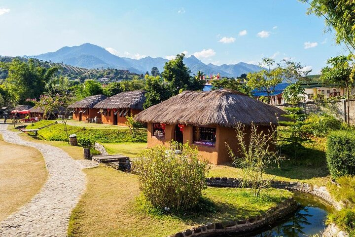 Discover the charm of Pai with cozy cottages nestled in lush greenery surrounded by majestic mountains—an ideal backdrop for exploring hot springs cultural gems and scenic wonders.