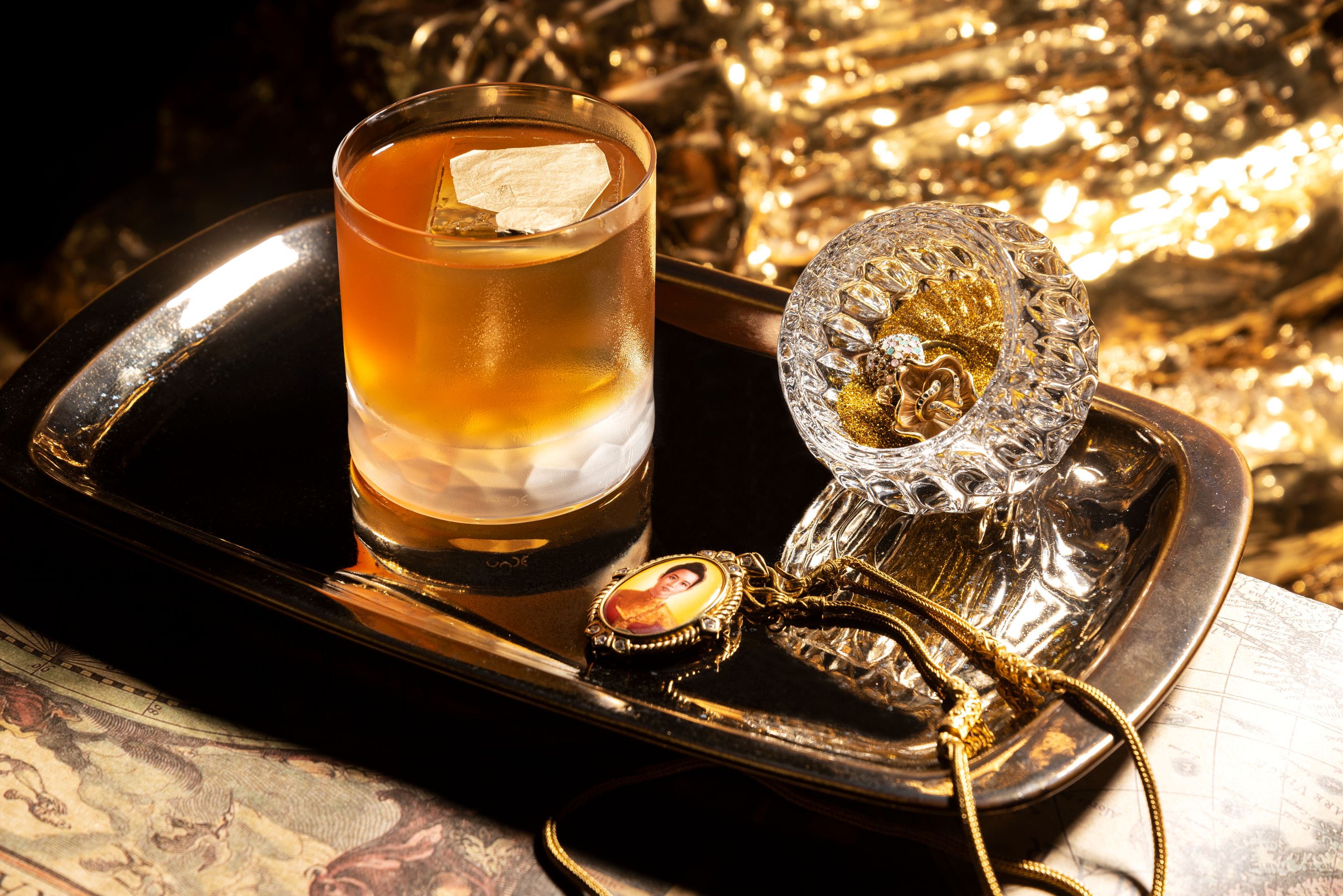 Sombat Bar invites you to explore a unique blend of Thai mixology where each signature cocktail reflects the charm of a treasure-filled collector's haven. Experience a drink like no other.