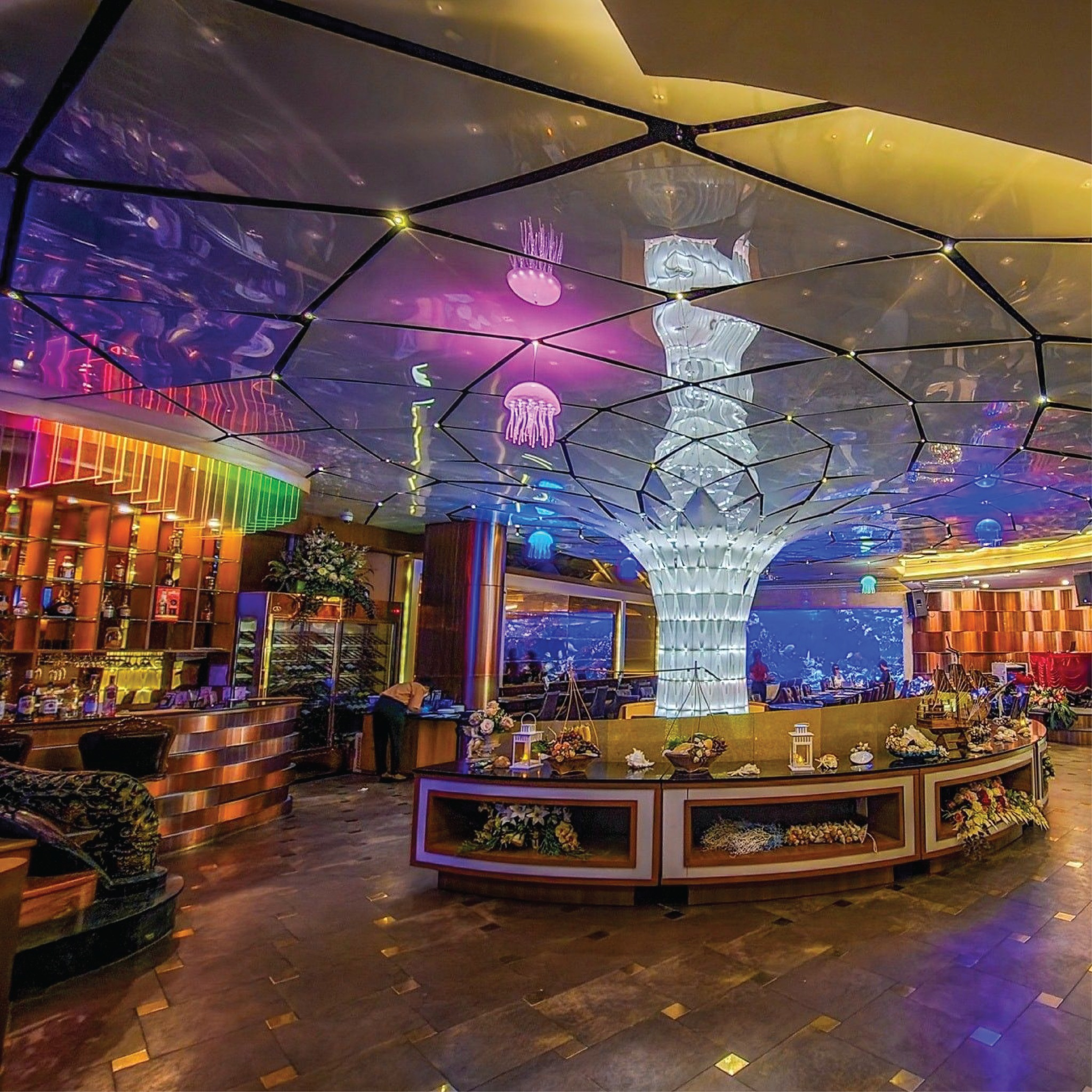 Dine under the mesmerizing glow of a stunning aquarium and sculpted copper savoring a fusion of global cuisines and fine wines in an unforgettable setting.