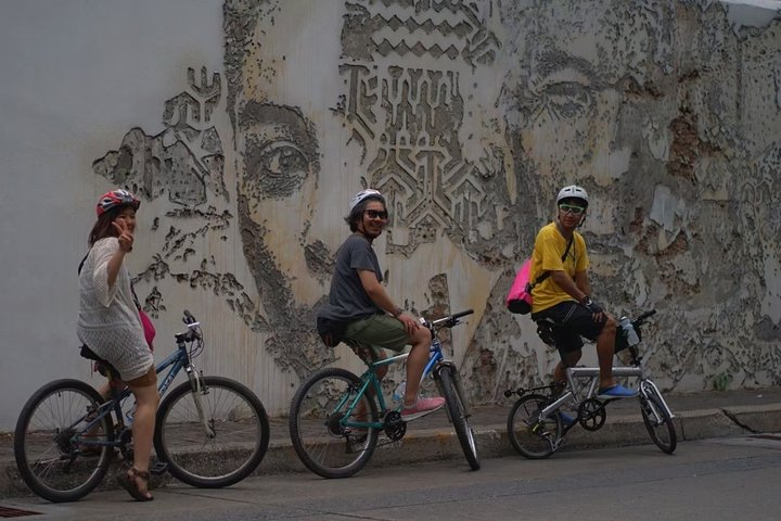 Explore the charming streets of BangRak where history and cultures intertwine as you pedal through captivating murals and uncover hidden gems on the journey to Koh Rattanakosin.