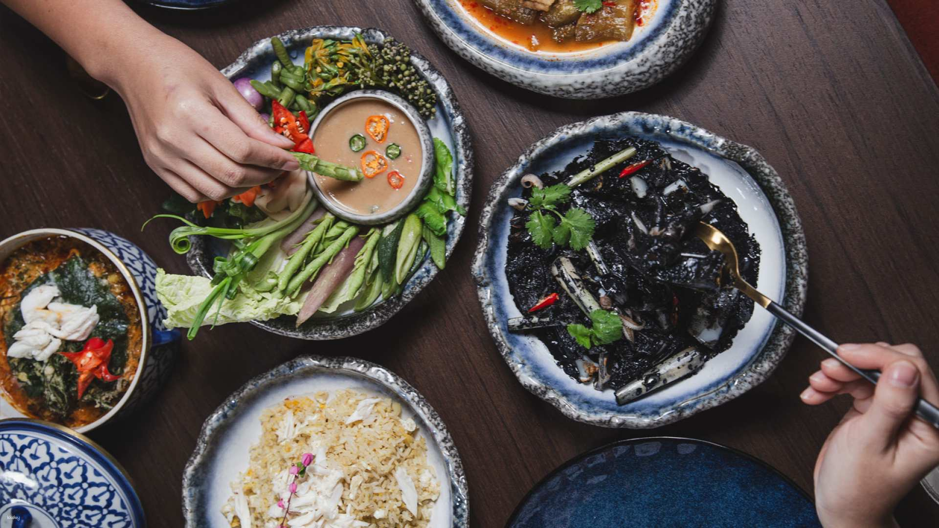 Savor the essence of Thailand with a feast showcasing authentic seafood and freshwater delicacies artfully prepared using locally sourced ingredients for a memorable dining experience.