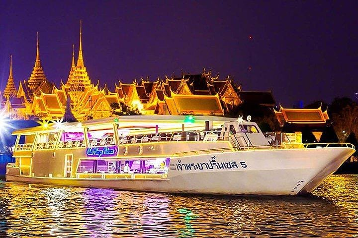 Savor delicious Thai cuisine while cruising the Chao Phraya River surrounded by stunning night views and lively entertainment that showcases the beauty of Bangkok's culture.