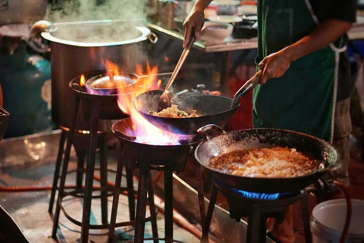 Experience the hustle and bustle of Bangkok's Chinatown as fragrant dishes sizzle in the pan. Taste authentic street food while uncovering culinary treasures at every turn on this delicious adventure.