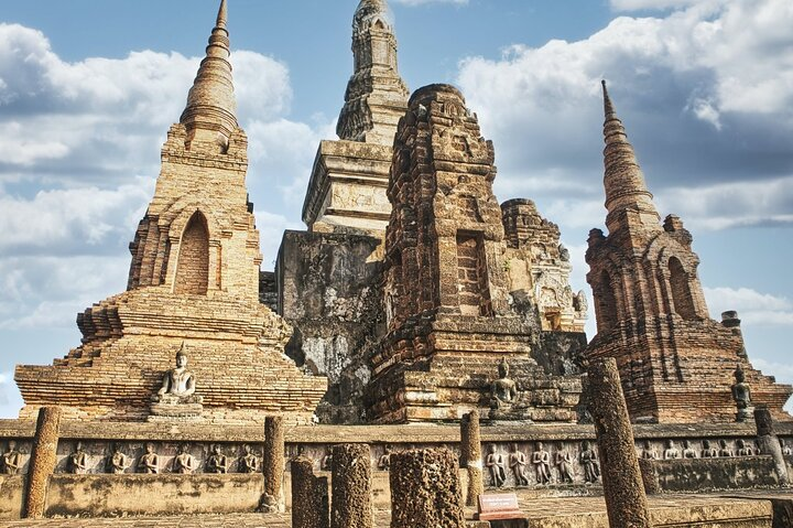 Explore the majestic ruins of Ayutthaya where ancient temples tell stories of a powerful kingdom inviting travelers to uncover their secrets on a memorable bicycle adventure.