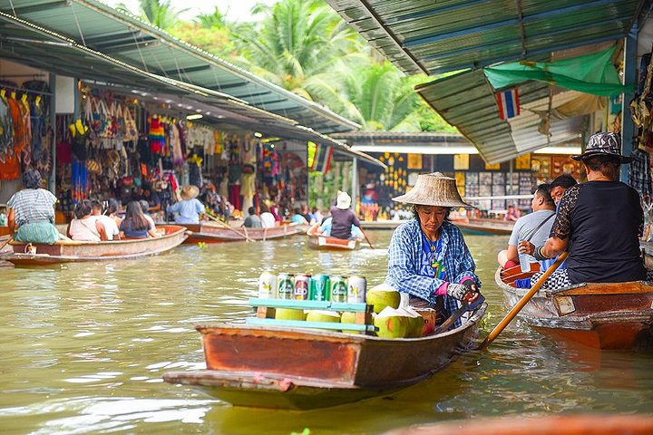 Experience the charm of Thailand's floating markets as colorful canoes glide through tranquil canals showcasing local life and an array of fresh produce making every moment unforgettable.