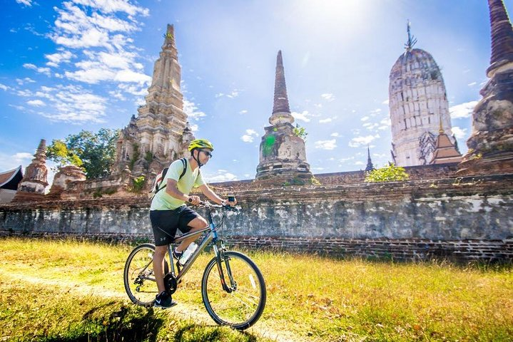 Pedal through history as ancient temples rise around you revealing the charm of Ayutthaya's rich heritage and scenic landscapes perfect for an unforgettable biking adventure.