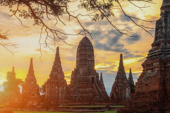 Explore the rich history of Ayutthaya with its stunning temple ruins at sunset where ancient architecture meets the culinary delights of authentic Thai cooking. A perfect journey for culture enthusiasts!
