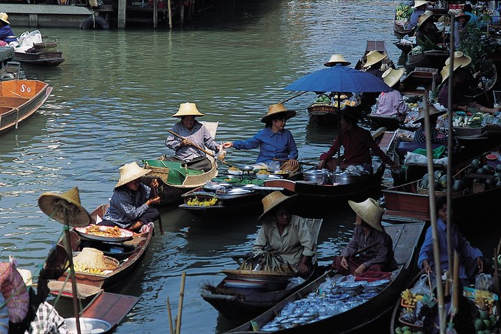 Experience the charm of bustling boat vendors and colorful produce at Bangkok's Floating Market along with a peek into organic farming practices that promote sustainability.