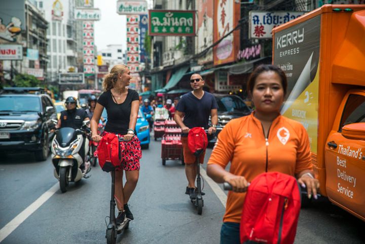 Experience Bangkok like never before on an e-scooter weaving through lively streets enjoying local sights and embracing the city's unique charm while getting some exercise and fresh air.