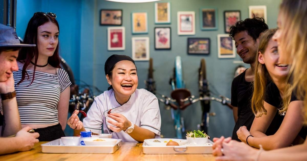 Experience the joy of cooking authentic Thai dishes with friends guided by a passionate instructor. Share laughter and delicious meals in a welcoming space filled with local charm.