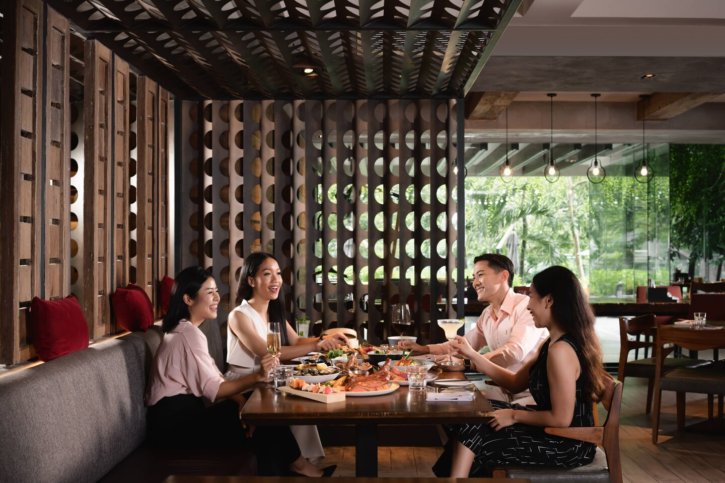 Gather around a beautifully set table at Goji Kitchen & Bar where delicious grilled meats and fresh seafood invite friends and family to share memorable dining experiences in Bangkok.