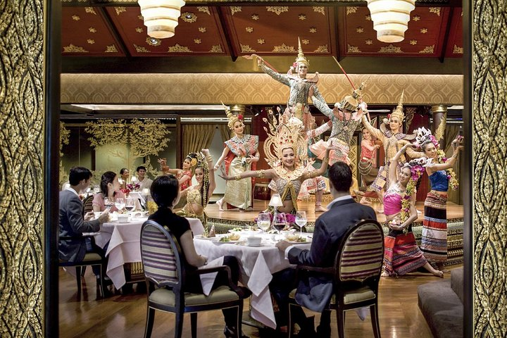 Indulge in a sensory feast as you savor exquisite Thai dishes while witnessing a traditional dance performance all set in a beautifully designed pavilion. A must-try for culinary explorers!