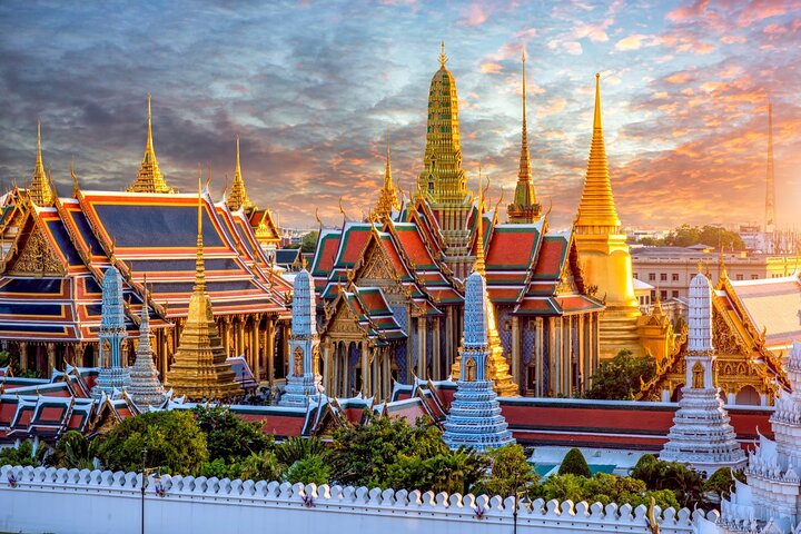 Discover intricate architecture and rich history as you stroll through the Grand Palace grounds where each corner reveals stunning artistry and tales of Thailand's royal heritage.