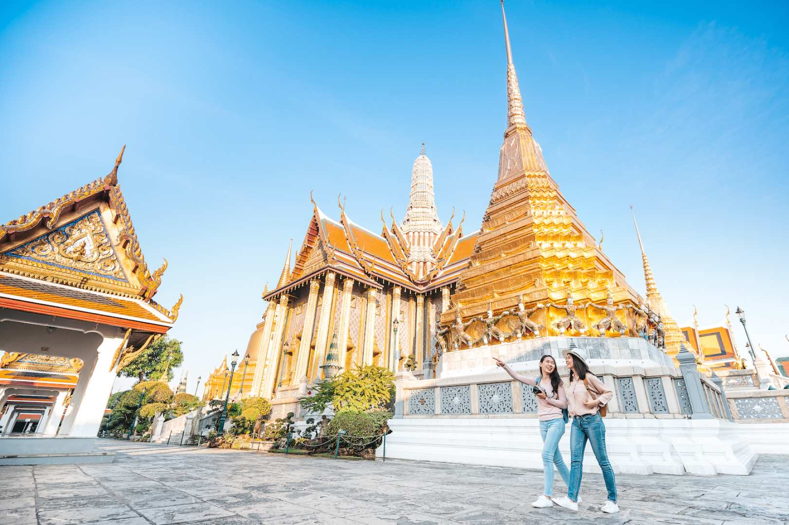 Experience the rich heritage of Bangkok as you stroll through the majestic Grand Palace admiring intricate architecture and vibrant local culture while witnessing traditional worship at Wat Phra Kaew.
