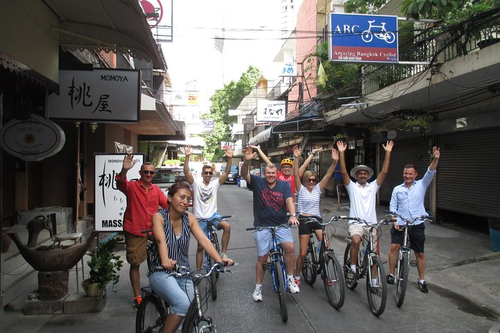 Peddle through Bangkok's hidden gems immersing in local culture while cycling through lush greenery and charming streets creating unforgettable memories with fellow explorers.