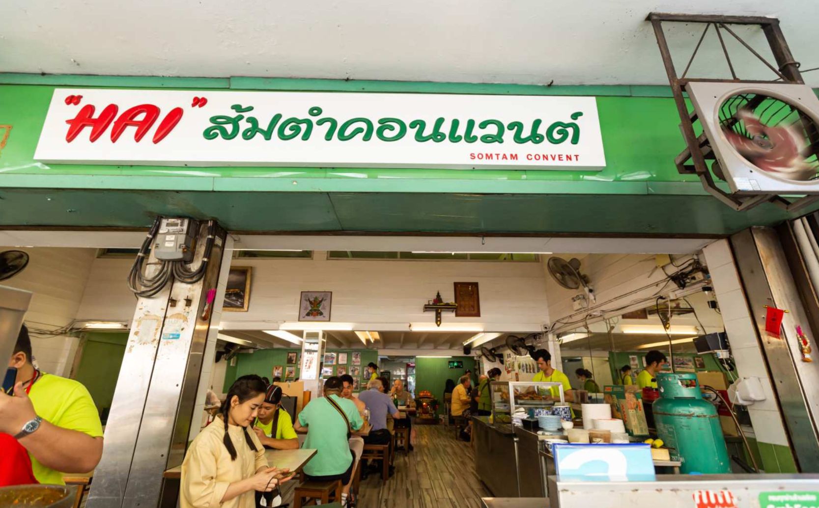 Experience the essence of Northeastern Thailand at Hai Som Tum Convent where locals gather to savor authentic Isaan flavors in a lively setting making every meal a delightful adventure.