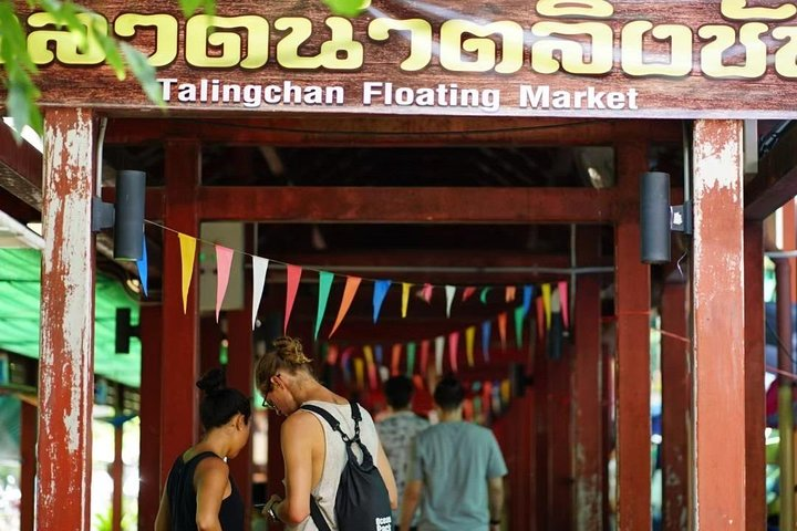 Explore the lively paths of Taling Chan Floating Market where local goods handmade crafts and unique culinary delights await making every moment a memorable discovery in Bangkok.