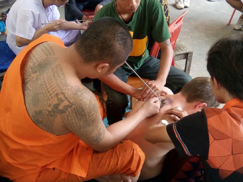 Experience the rich tradition of Sak Yant at Wat Bang Phra where monks impart sacred tattoos that symbolize protection and luck creating lifelong memories in a serene setting.