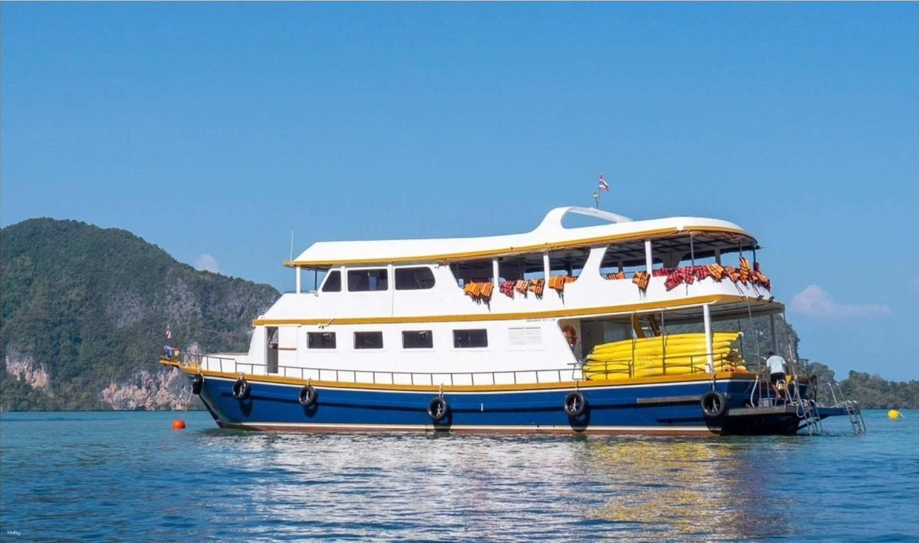 Experience the stunning beauty of Phang Nga Bay from the comfort of a sea canoe exploring hidden caves lagoons and diverse wildlife while enjoying delicious Thai cuisine onboard.