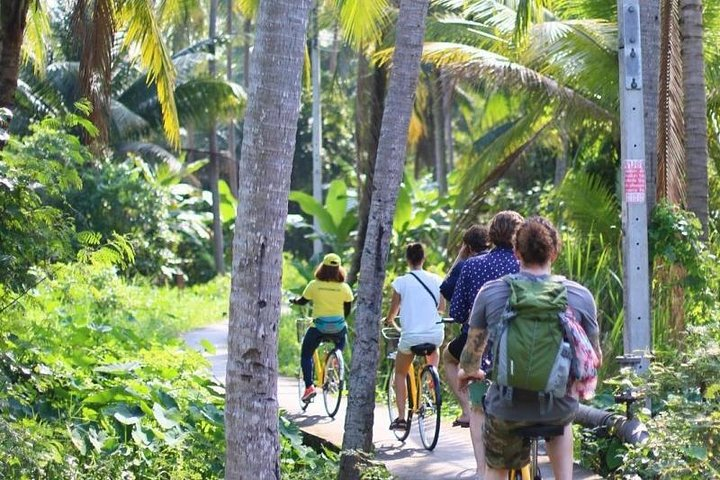 Pedal through lush greenery and immerse in the local charm of Bangkok's canals discovering daily life as you cycle past families and traditional homes.